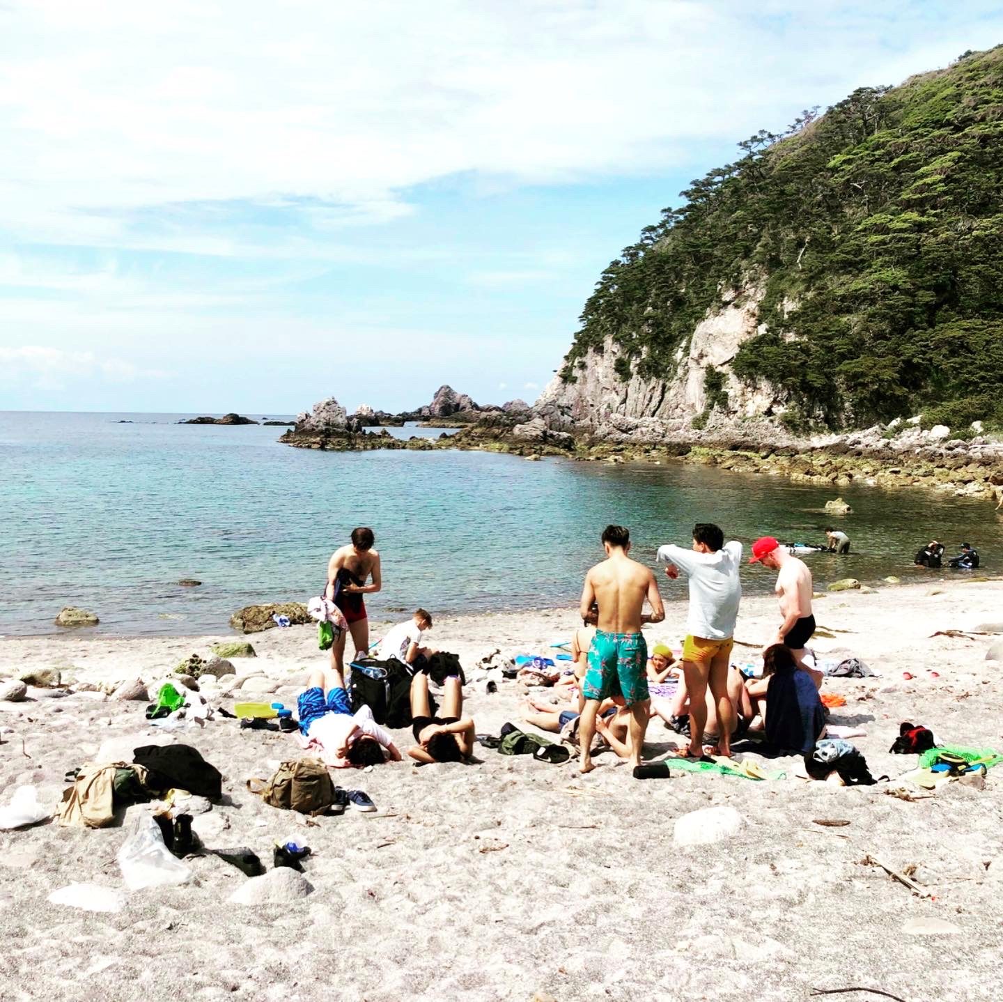 A hidden beach cove full of friends
