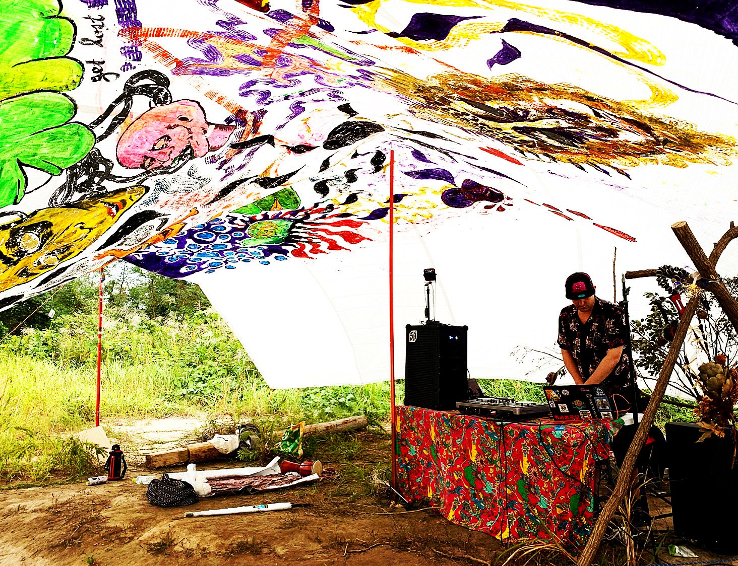 Hand-painted canopy over a riverside DJ booth