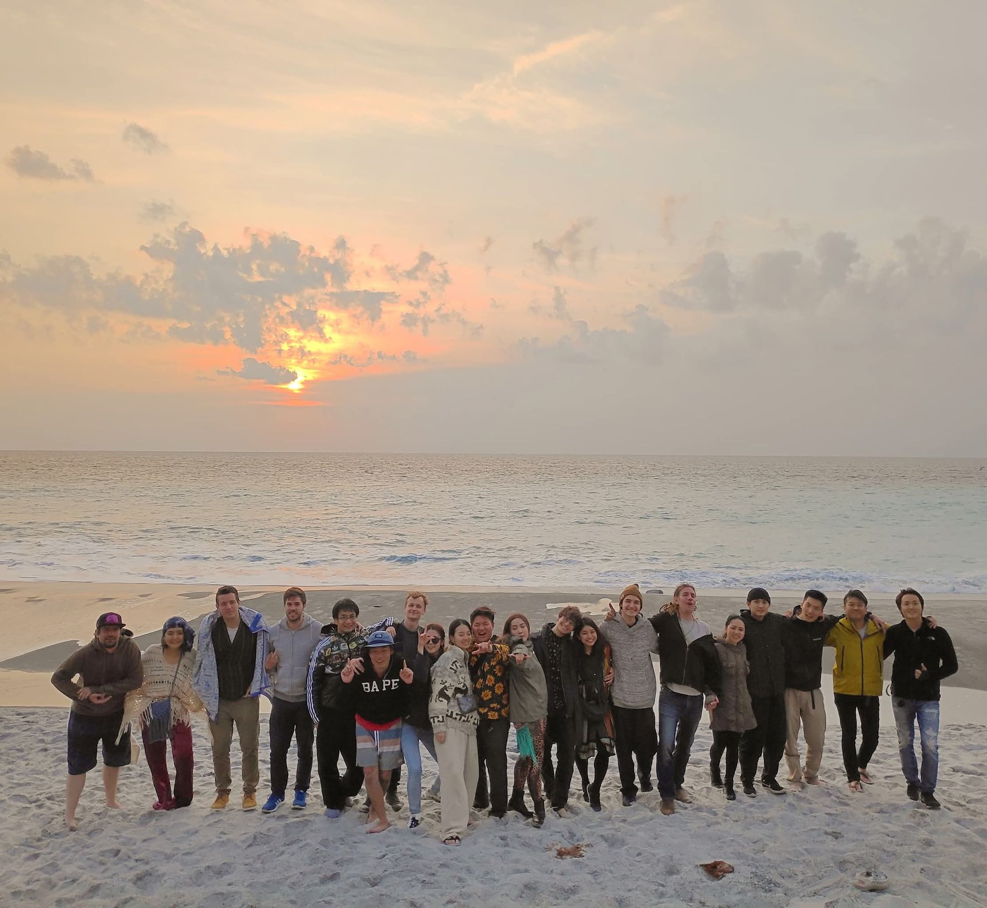 The LiQUiD family together on the beach at sunset