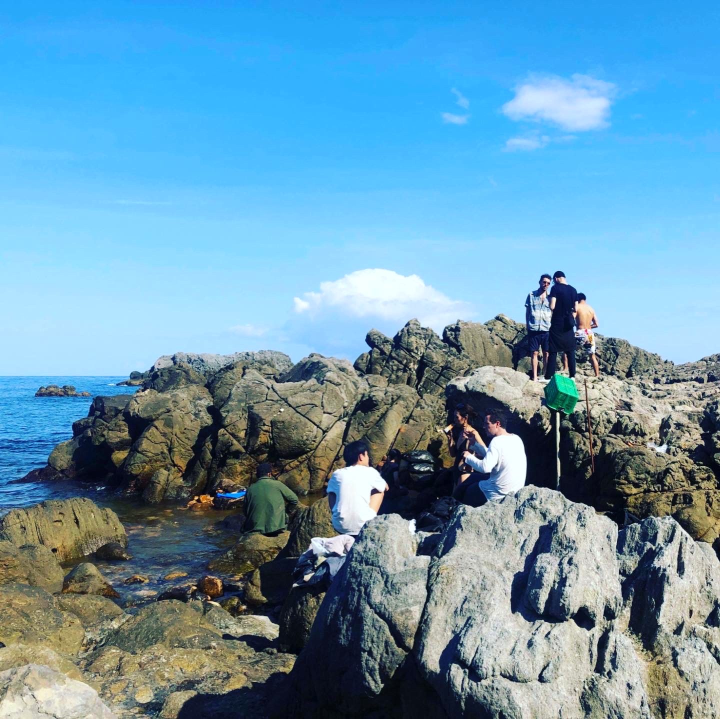 DJ set on the rocks by the sea