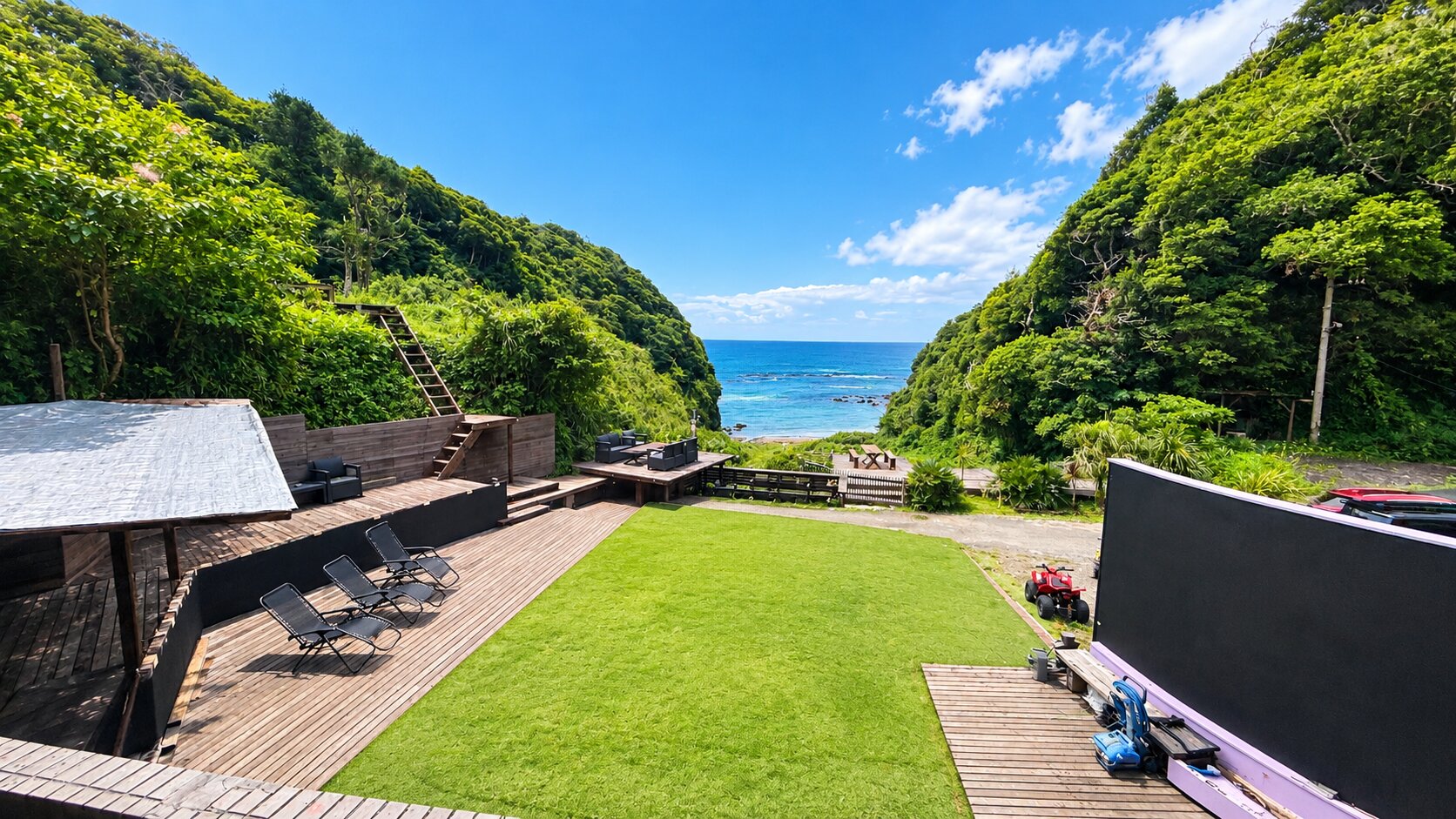 The Sea Stage: a lawn between green hills opening to the ocean